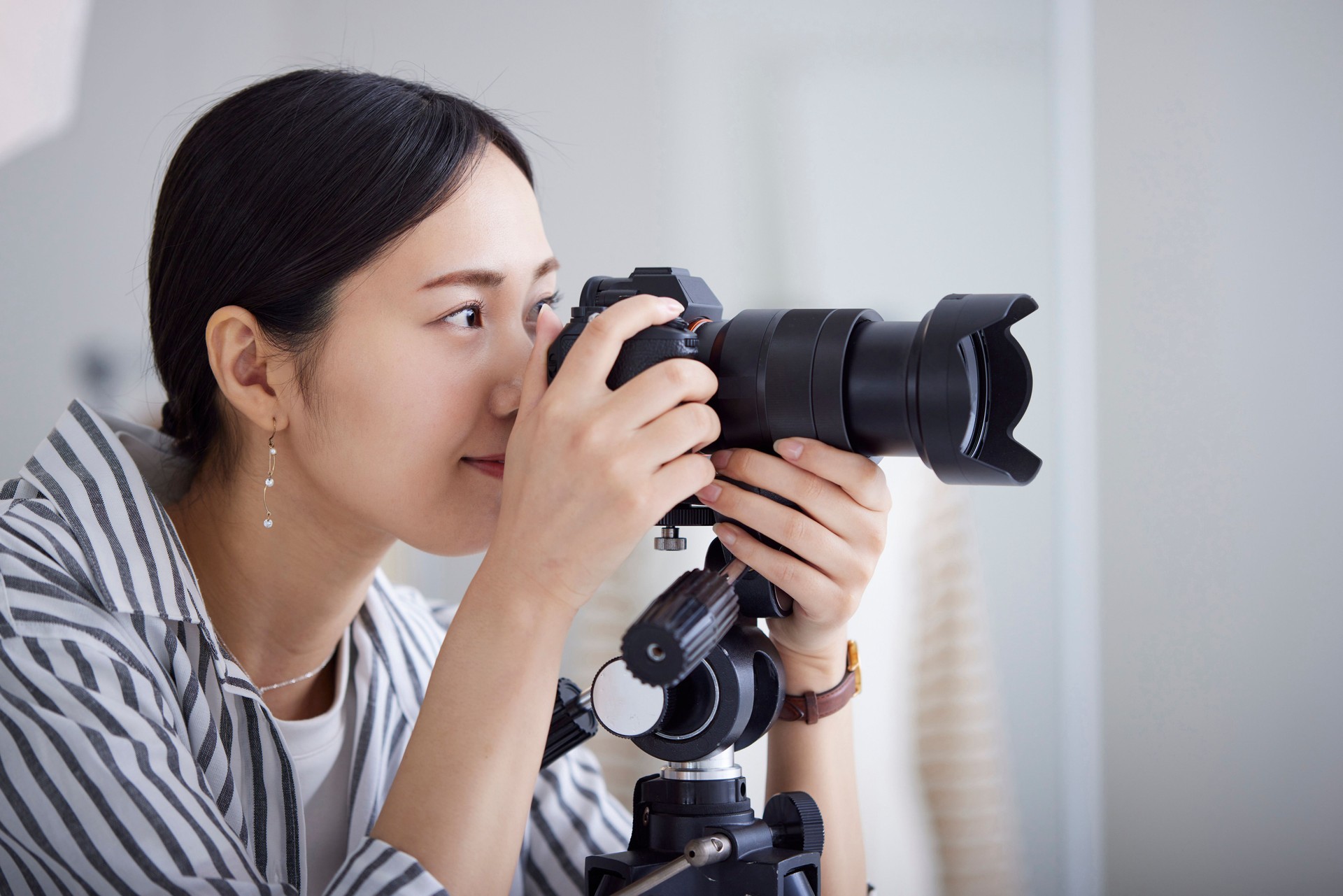 Japanese young woman working as a photographer